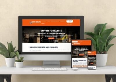 Desk with tech devices mock up Smyths Forklifts Website
