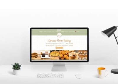 Doreens Home Bakery Website Showcase Desktop PC Screen on modern white office desk smaller ()