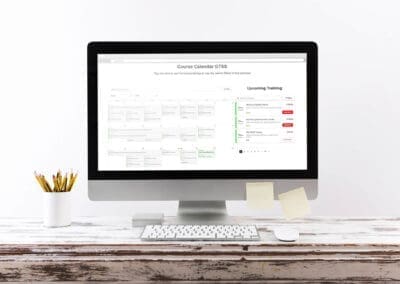 GTSS Booking System Computer Mockup Wooden Desk ()